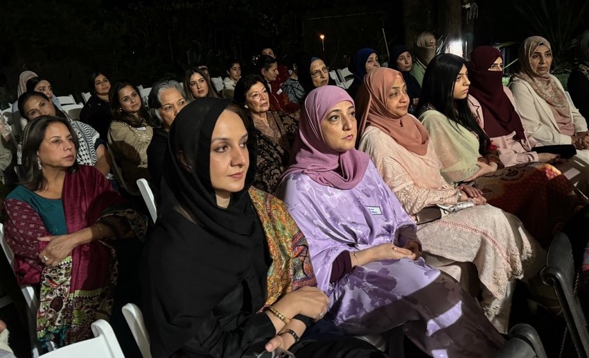 A group of women sitting in chairs

Description automatically generated