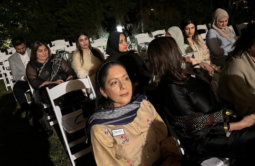 A group of women sitting in chairs

Description automatically generated