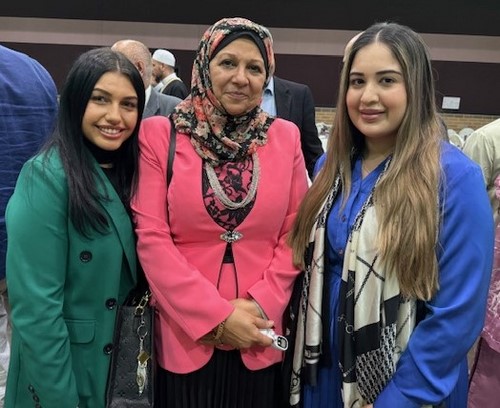 A group of women posing for a photo

Description automatically generated