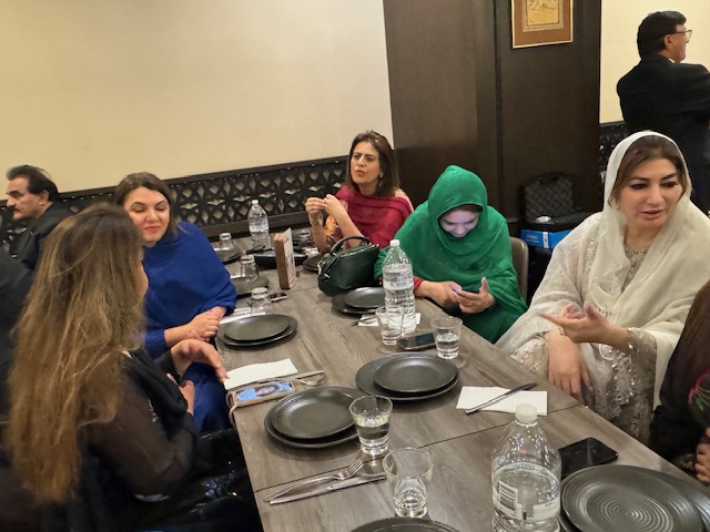 A group of women sitting at a table

Description automatically generated