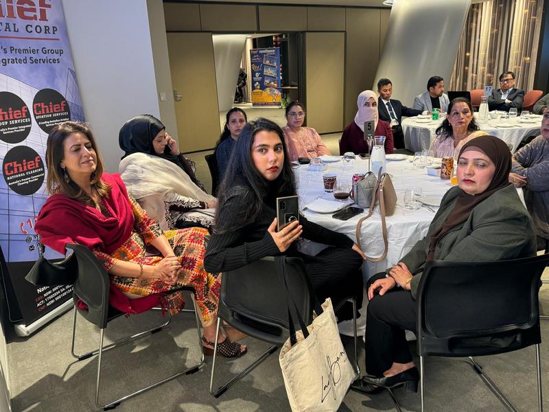 A group of women sitting at a table

Description automatically generated