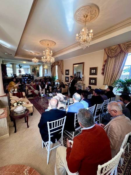 A group of people sitting in chairs in a room

Description automatically generated