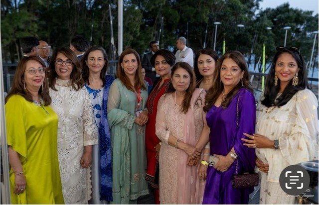 A group of women posing for a photo

Description automatically generated