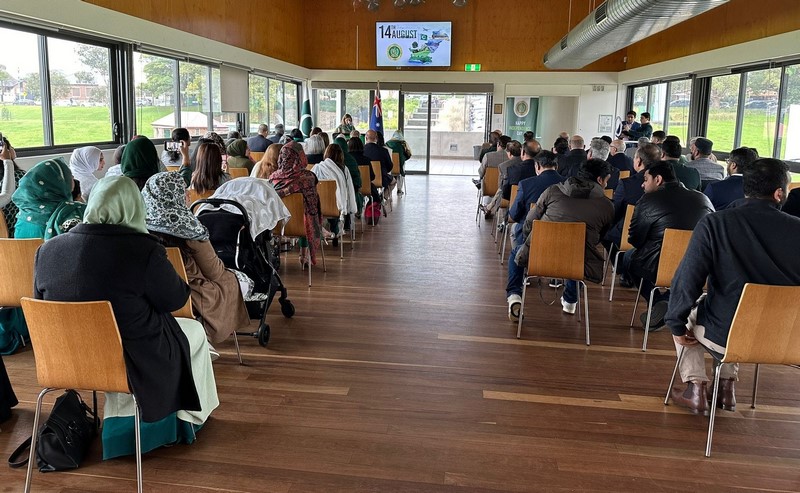 A group of people sitting in chairs in a room

Description automatically generated